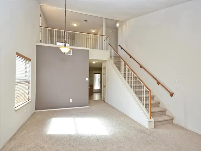 a view of a hallway with staircase