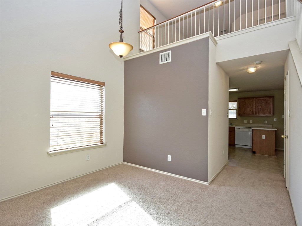 3600 Spring Canyon Trail Round Rock, TX 78681 - Photo 7 of 30 a view of a kitchen with a dishwasher and a window