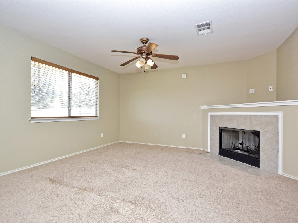 3600 Spring Canyon Trail Round Rock, TX 78681 - Photo 9 of 30 a view of livingroom with fireplace fan and windows