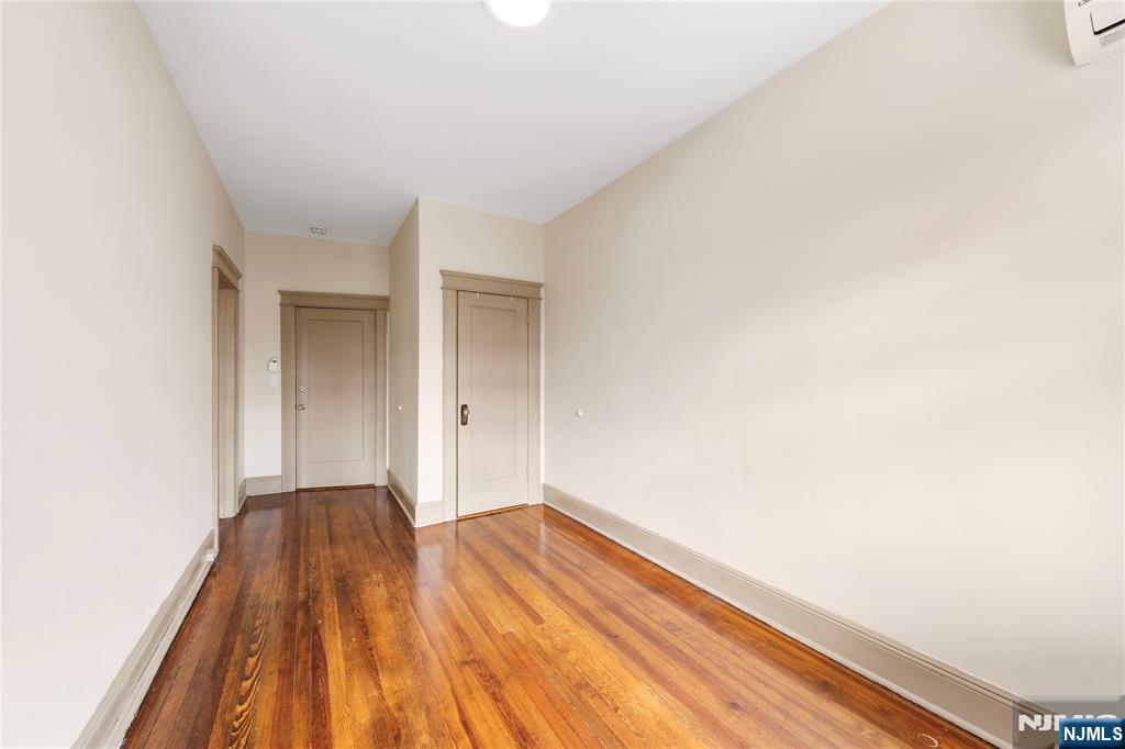 598 67th Street, Unit 1 West New York, NJ 07093 - Photo 4 of 22 a view of a room with wooden floor and a window