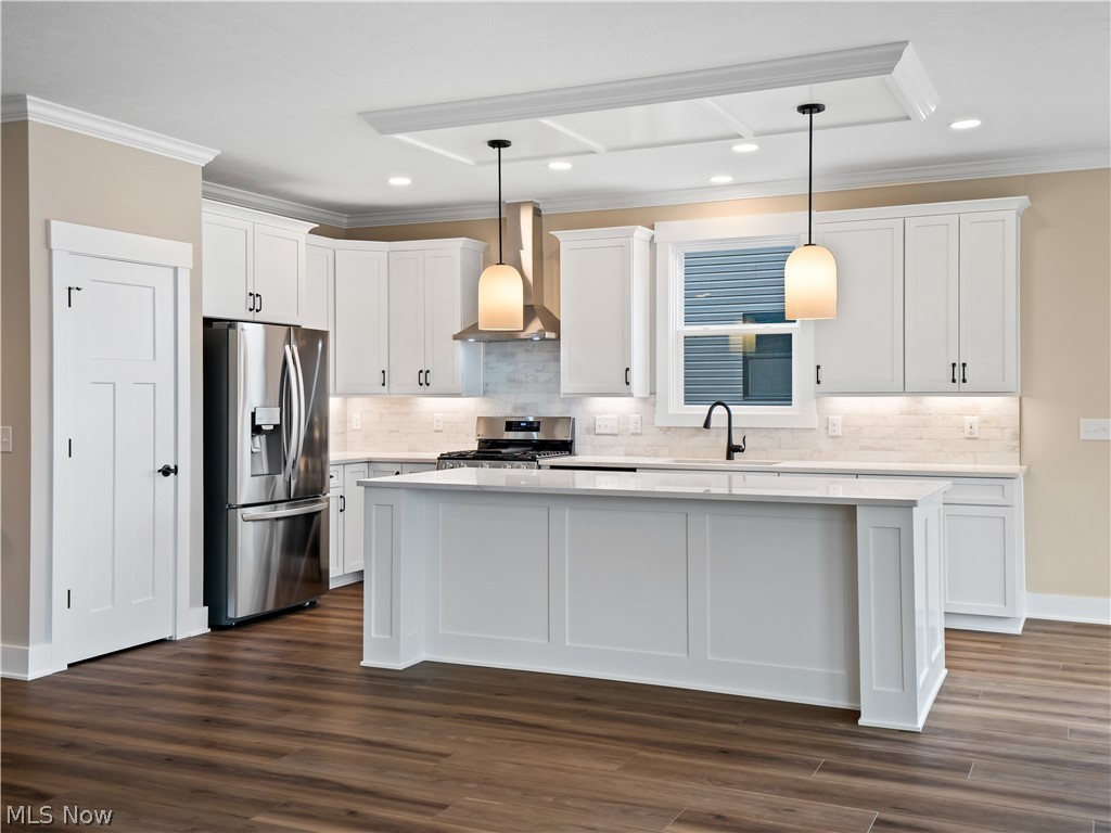 34270 Brookside Lane North Ridgeville, OH 44039 - Photo 16 of 50 Kitchen with ornamental molding, stainless steel appliances, white cabinets, a kitchen island, and decorative light fixtures