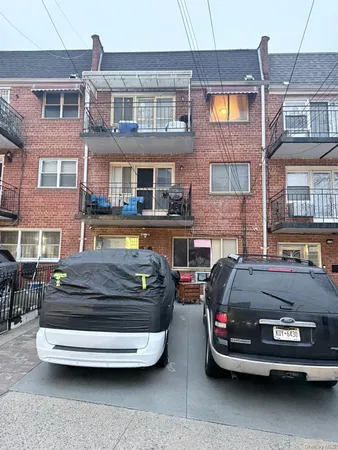a car parked in front of a brick building