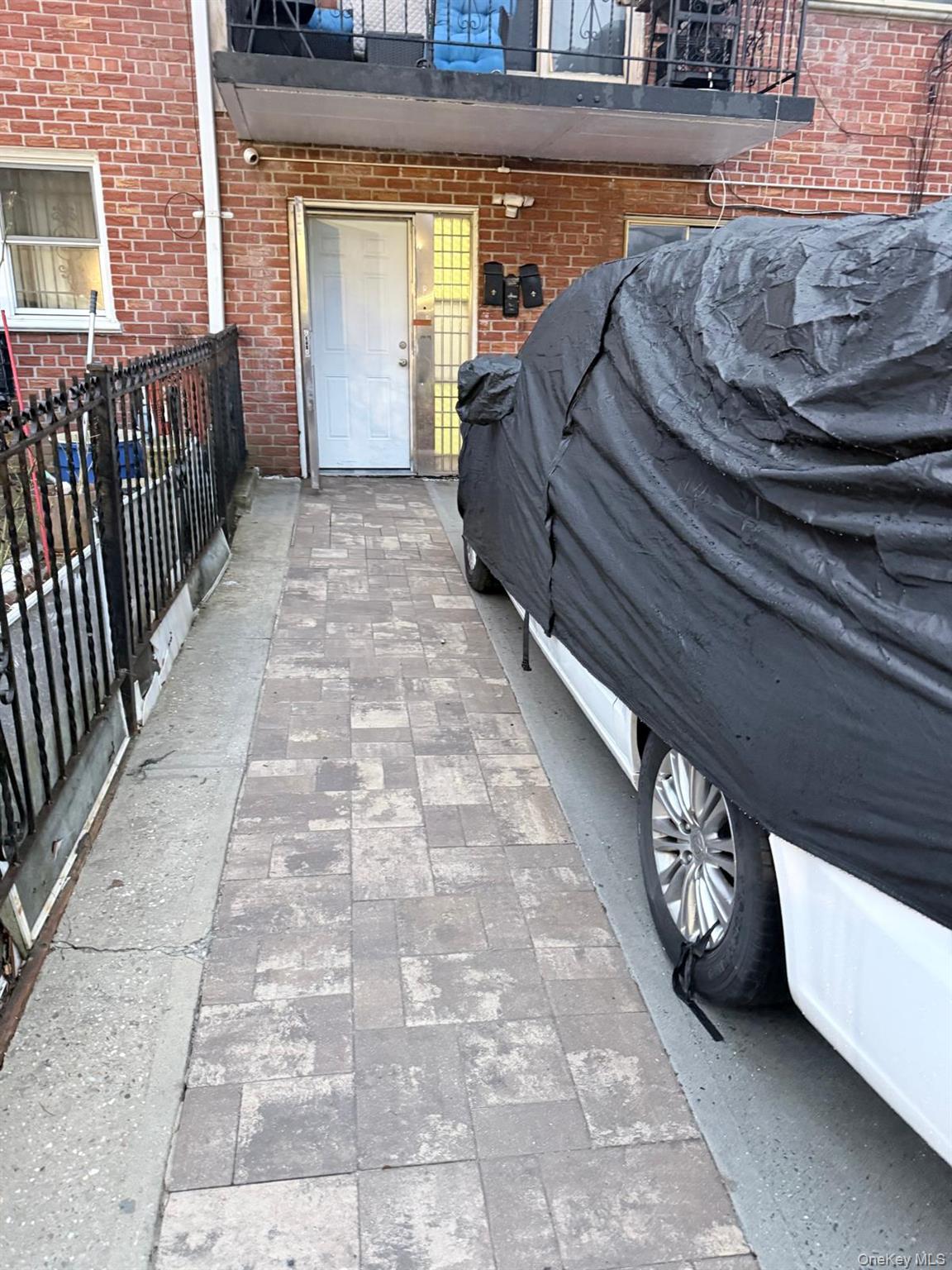 141-14 85th Road Queens, NY 11435 - Photo 2 of 3 a view of a porch with wooden floor