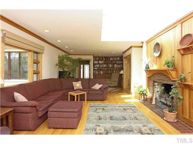 3101 Churchill Road Raleigh, NC 27607 - Photo 3 of 15 a living room with furniture and a fireplace