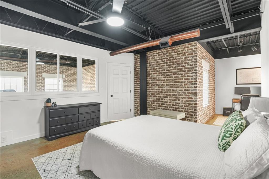 5434 Peachtree Road, Unit 119 Atlanta, GA 30341 - Photo 23 of 44 a bedroom with a large bed and a window