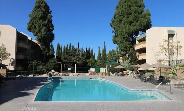 a view of outdoor swimming pool and seating