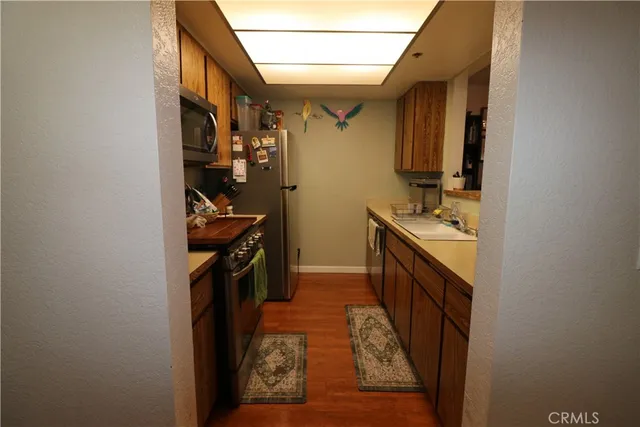 a utility room with sink dryer and washer