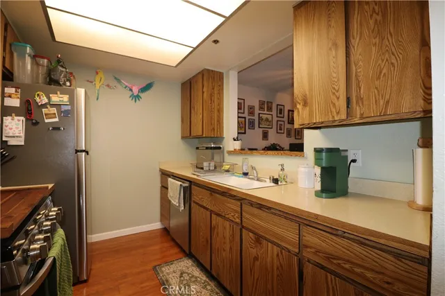 a kitchen with a sink and a refrigerator