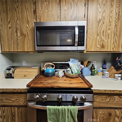 a kitchen with a stove and a microwave