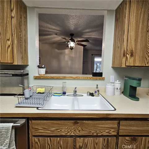 a kitchen that has a sink and a stove
