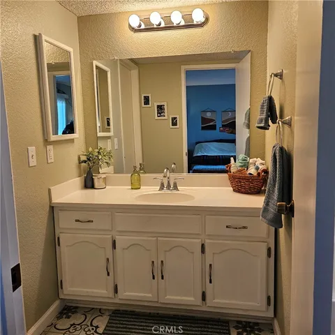 a bathroom with a sink and a mirror