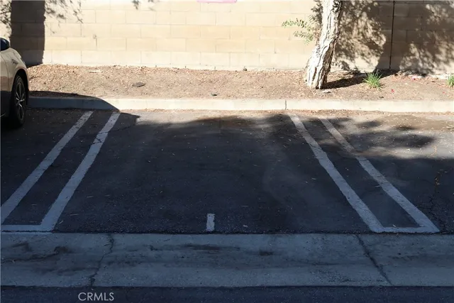 a view of street with parked cars
