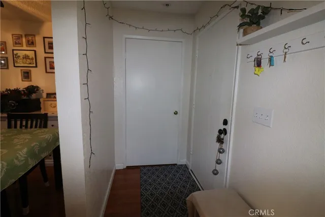a bathroom with a granite countertop toilet and a sink