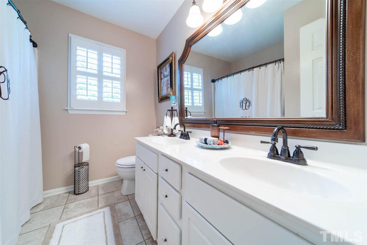 10001 Duval Street Raleigh, NC 27614 - Photo 14 of 19 Tile floors and double vanity in the secondary bathroom!