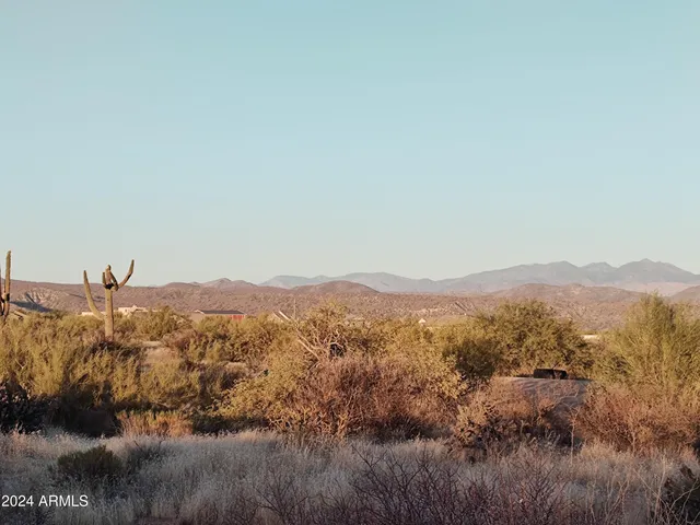 a view of a town with mountains in the background