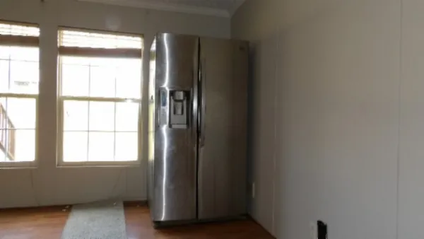 a view of an empty room and window