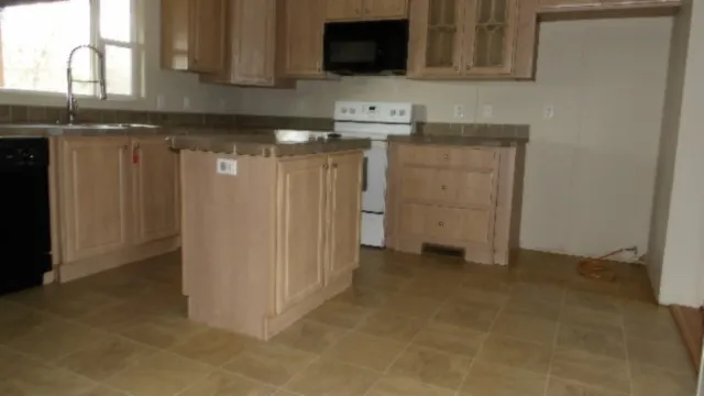 a view of a kitchen with a sink