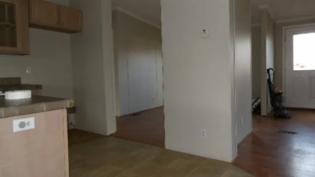 a kitchen with a refrigerator and a stove