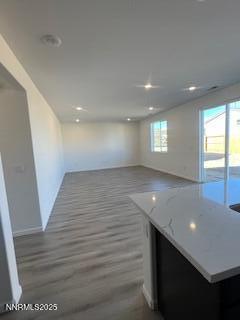 8465 Endor Drive, Unit LOT 87 Reno, NV 89506 - Photo 2 of 5 an empty room with wooden floor and windows