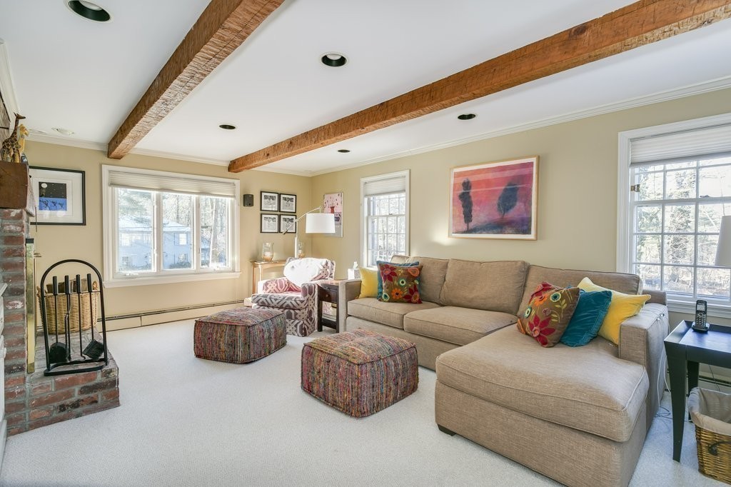 19 White Road Wayland, MA 01778 - Photo 18 of 27 a living room with furniture ceiling fan and a window