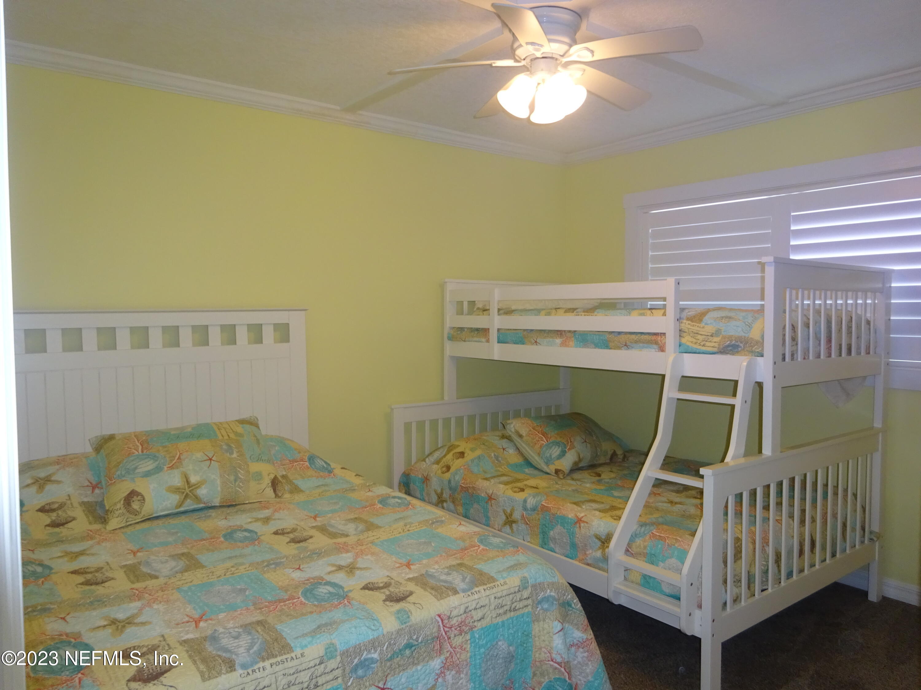 7175 A1A South, Unit F141 St. Augustine, FL 32080 - Photo 17 of 36 a bedroom with a bed and a window