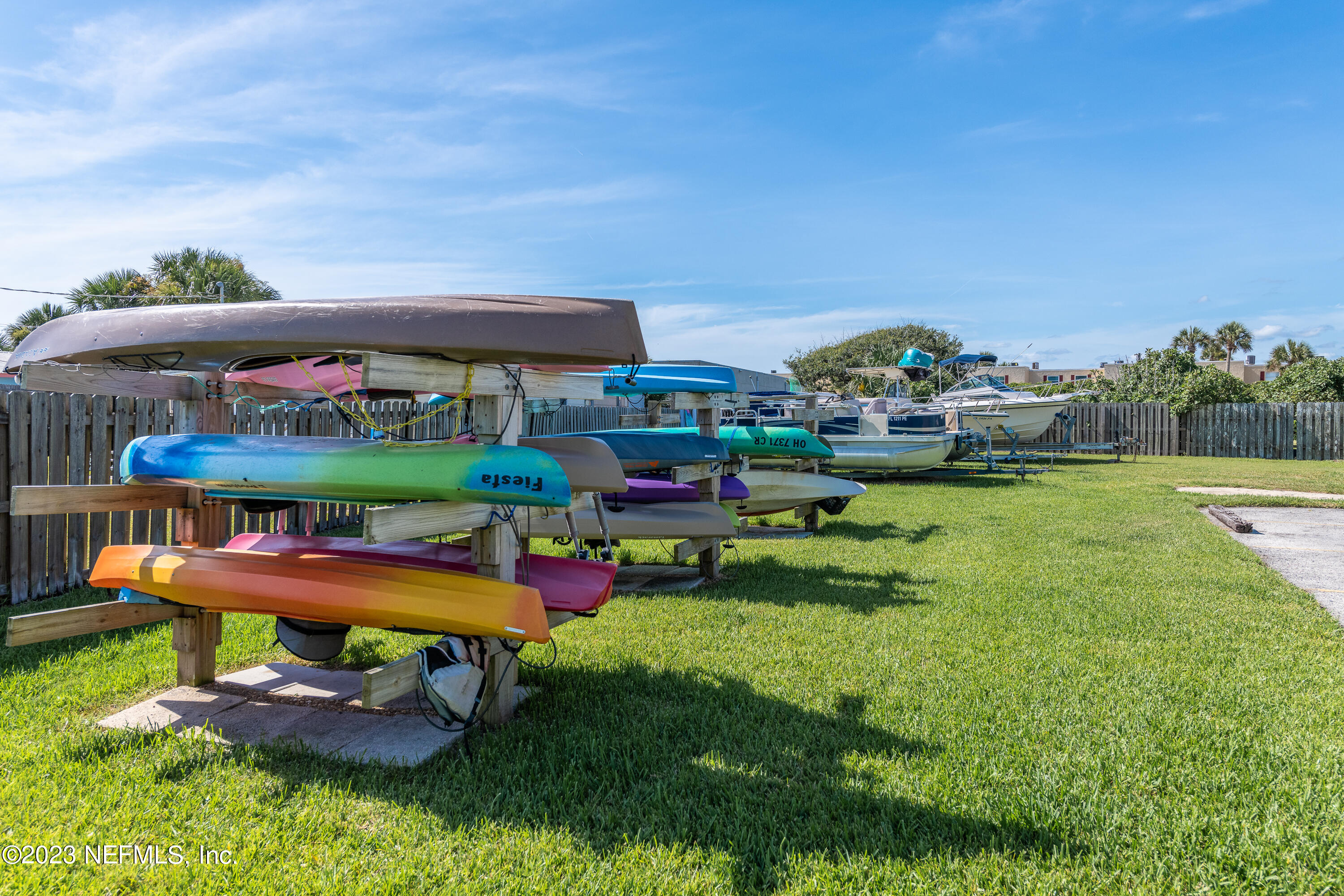 7175 A1A South, Unit F141 St. Augustine, FL 32080 - Photo 28 of 36 a view of a chairs and table in a patio