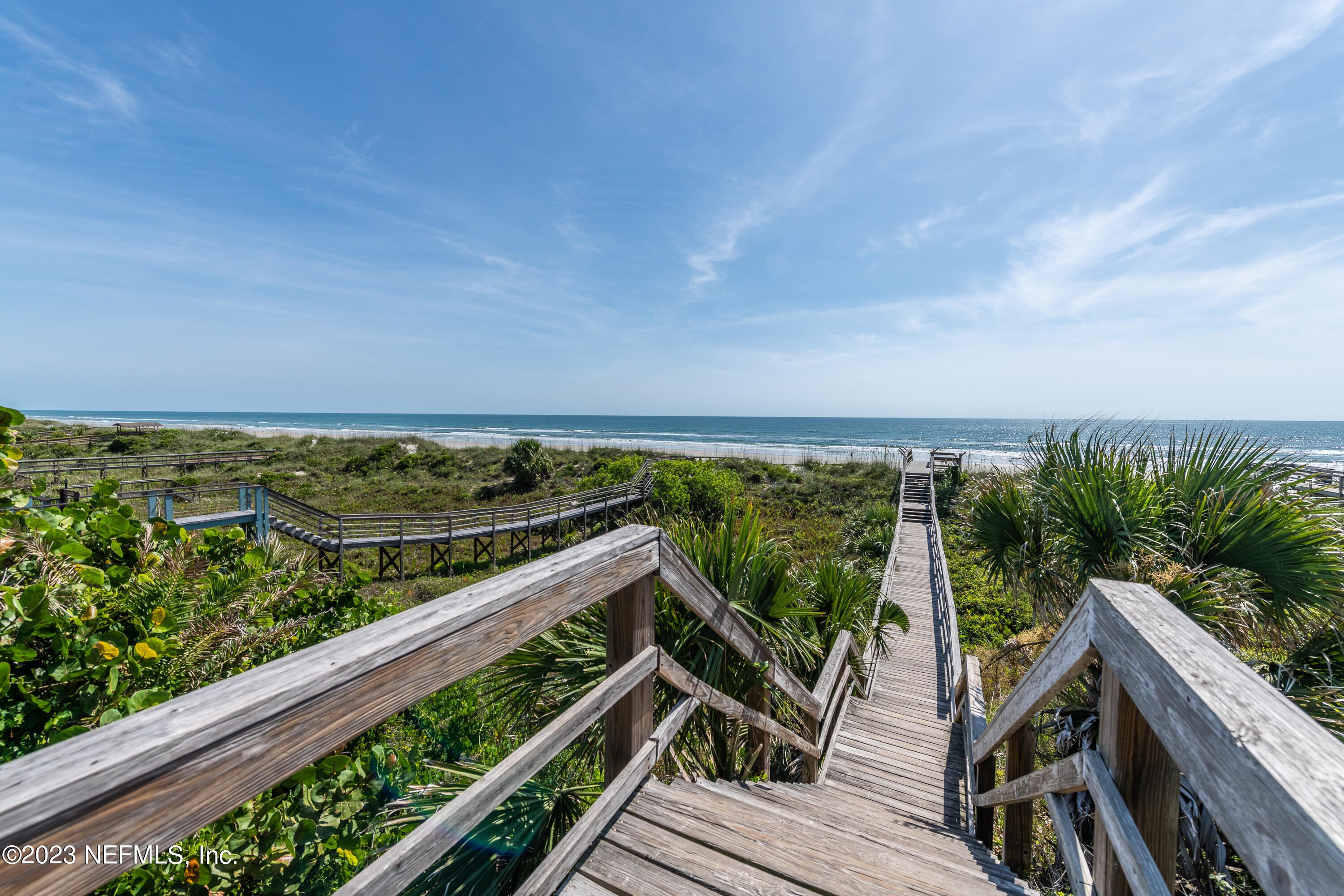 7175 A1A South, Unit F141 St. Augustine, FL 32080 - Photo 31 of 36 a view of a balcony with wooden floor and outdoor space
