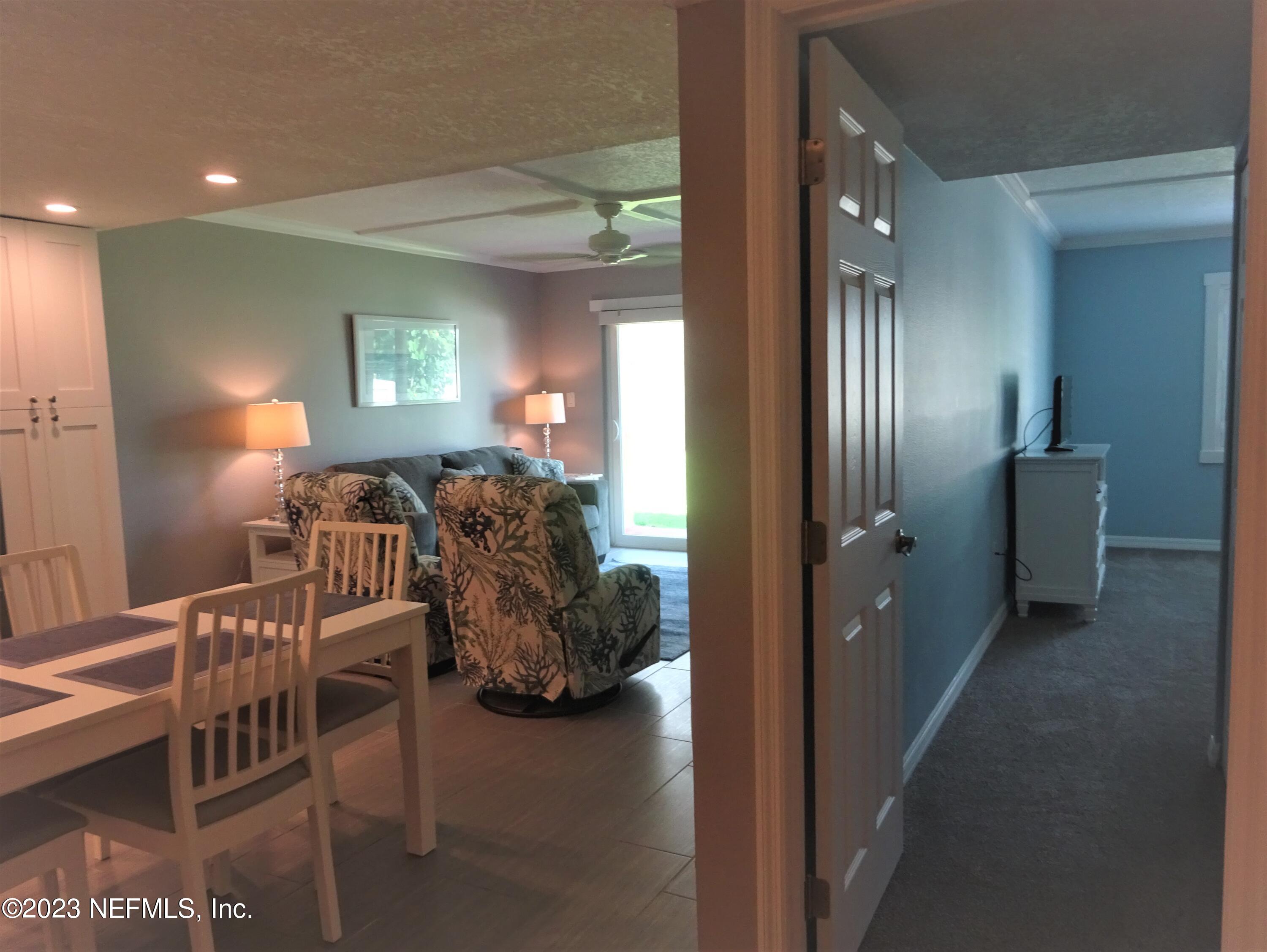 7175 A1A South, Unit F141 St. Augustine, FL 32080 - Photo 9 of 36 a view of dining room with furniture and wooden floor