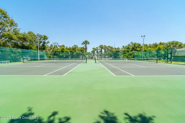 a view of an outdoor space and tennis court