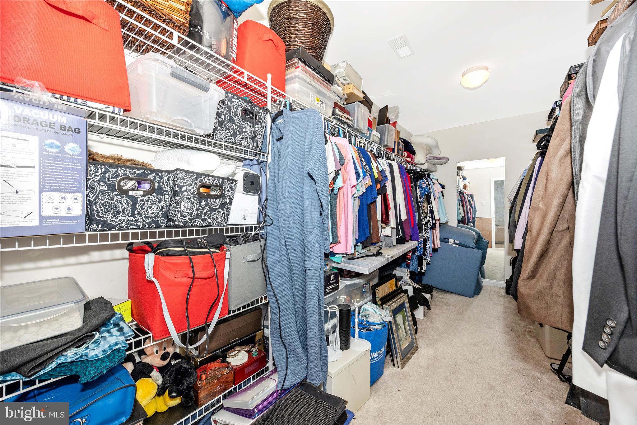 9855 McKinstry Mill Road New Windsor, MD 21776 - Photo 39 of 76 a view of walk in closet with clothes and shoes
