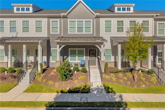 a front view of a house with garden