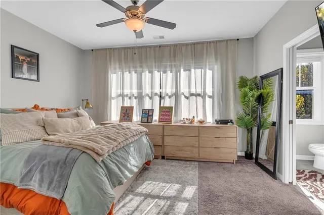 a bed room with a bed and a window