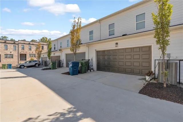 a front view of a building with parking