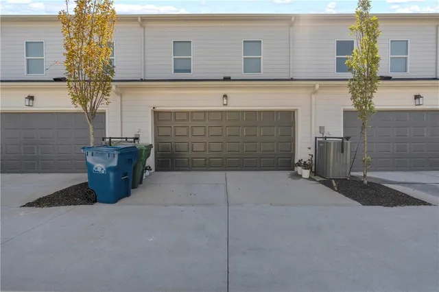 a front view of a house with parking space