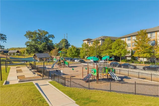 a view of a swimming pool with a patio and swimming pool