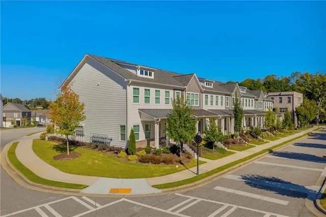 a view of a swimming pool with a garden and plants