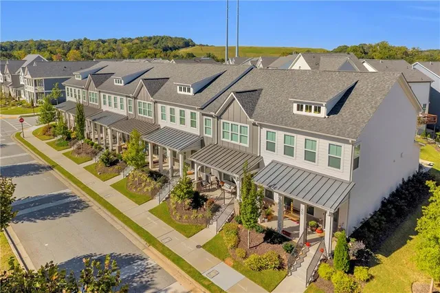 an aerial view of a house with a swimming pool
