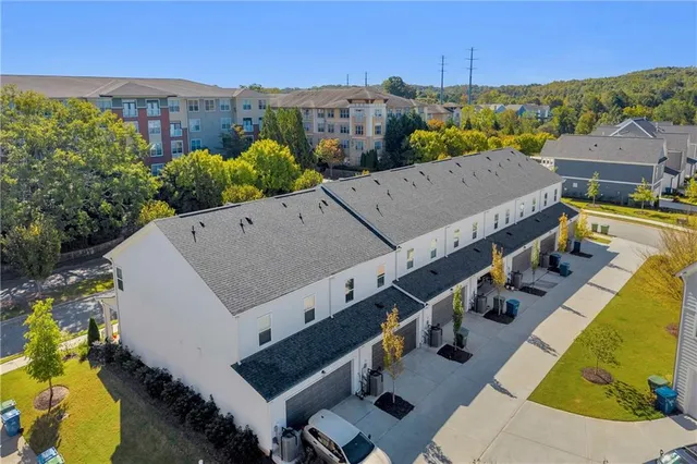 an aerial view of a house with a swimming pool