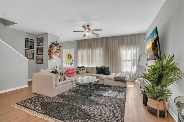 a living room with furniture rug and window