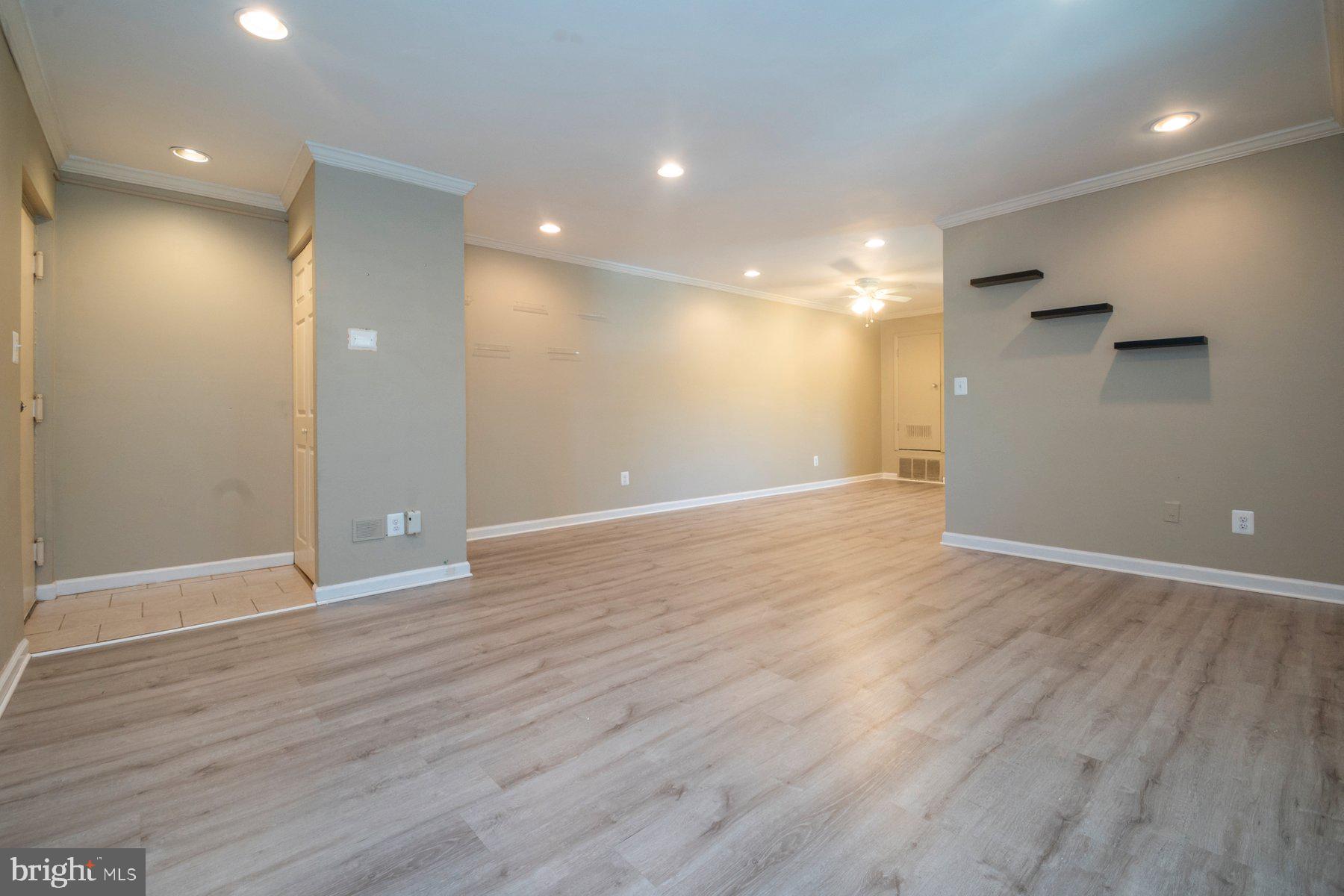 11906 Tarragon Road, Unit H Reisterstown, MD 21136 - Photo 5 of 24 Foyer, living room & dining room