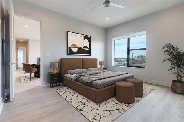 a bedroom with a large bed and a window