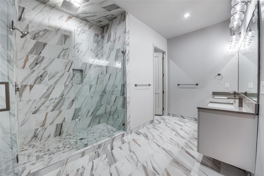 1900 South Ervay Street, Unit 512 Dallas, TX 75215 - Photo 9 of 22 a bathroom with a sink and a mirror