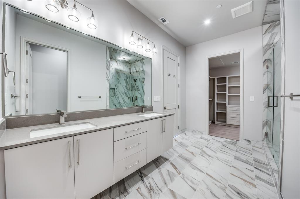 1900 South Ervay Street, Unit 512 Dallas, TX 75215 - Photo 10 of 22 a spacious bathroom with a granite countertop sink mirror and double