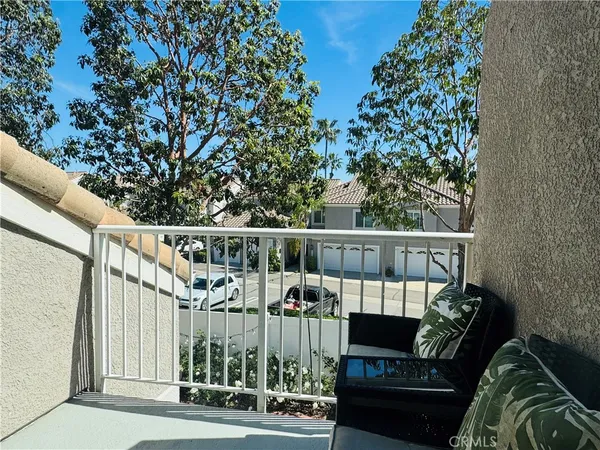 a view of a balcony with furniture