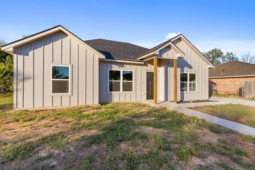 2913 Mildred Street Waco, TX 76706 - Photo 3 of 33 Modern inspired farmhouse featuring board and batten siding, a shingled roof, and a front lawn