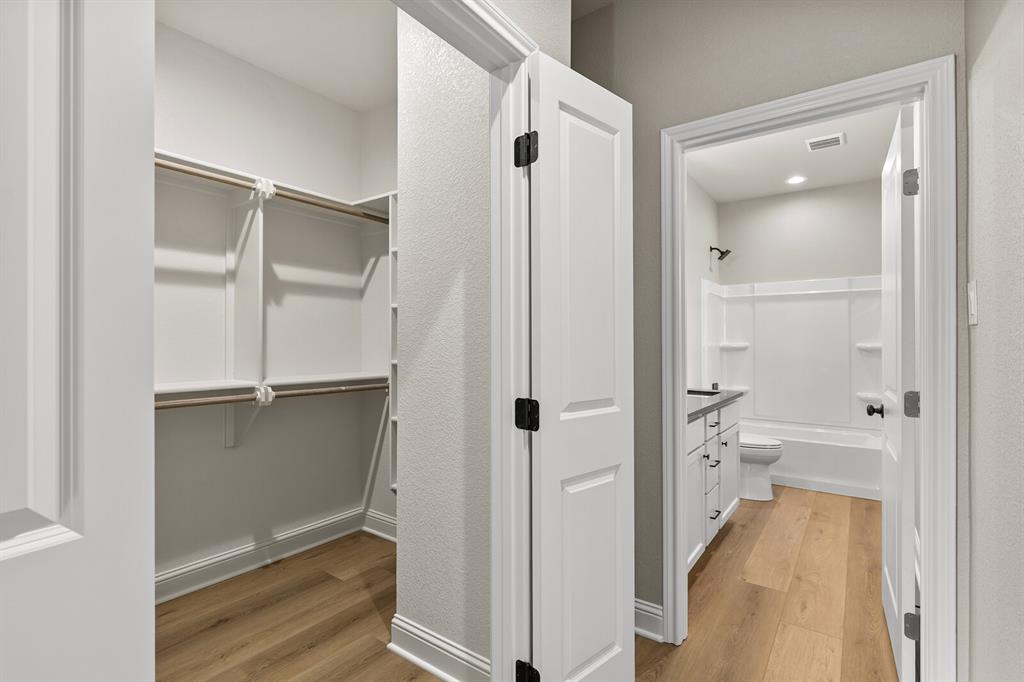 2913 Mildred Street Waco, TX 76706 - Photo 29 of 33 Spacious closet with light wood-style floors