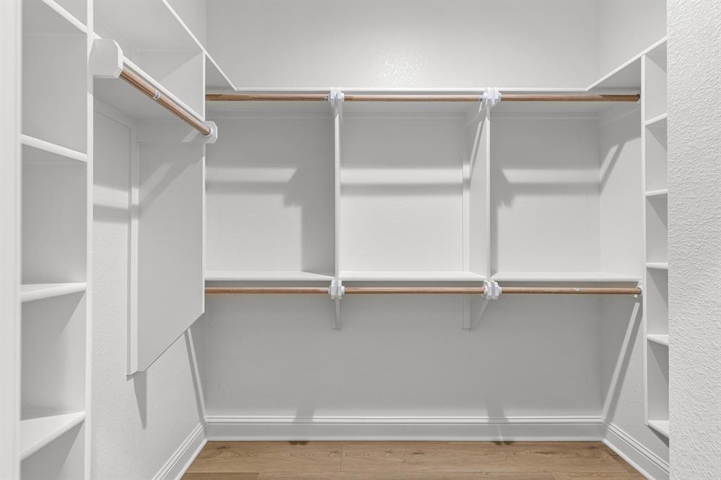 2913 Mildred Street Waco, TX 76706 - Photo 30 of 33 Walk in closet featuring light wood-style flooring