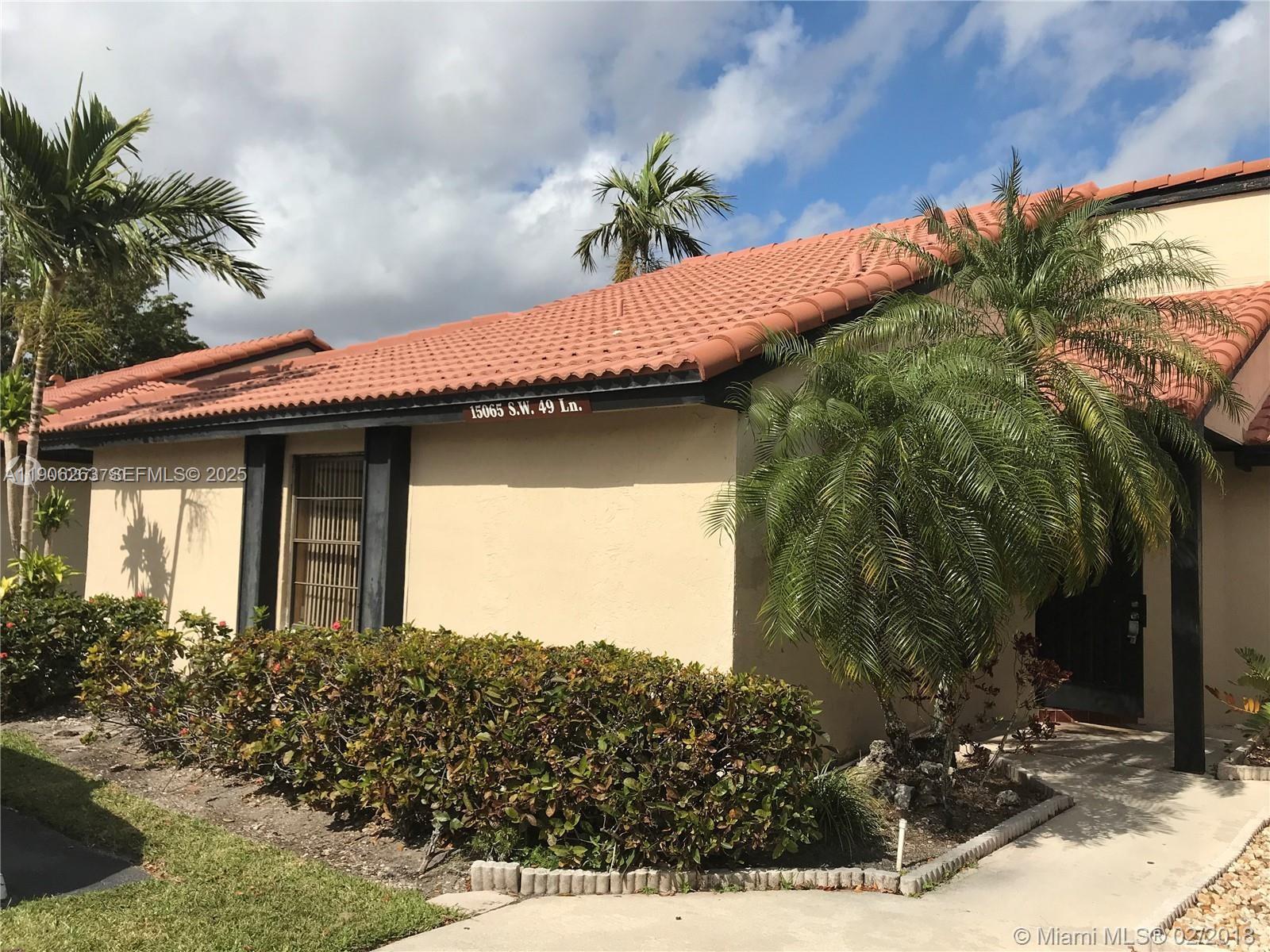 a view of a house with a small yard