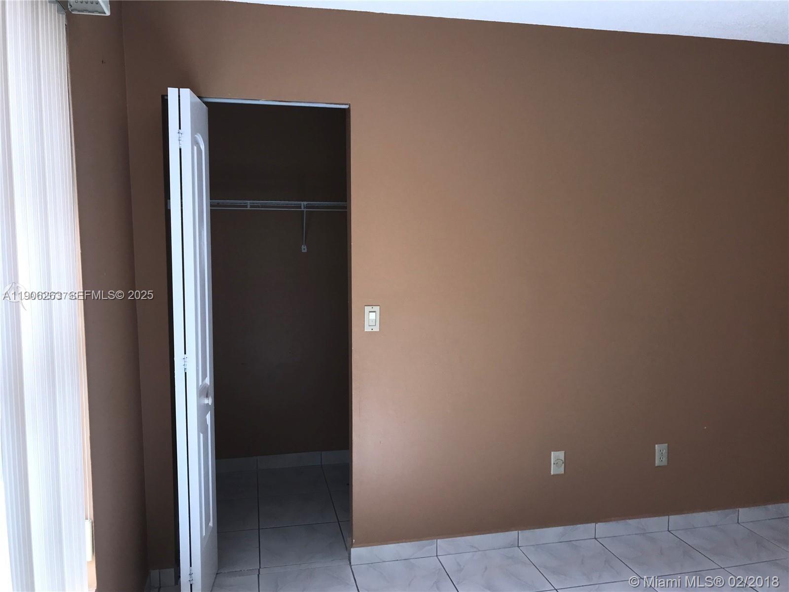 15065 Southwest 49th Lane, Unit E109 Miami, FL 33185 - Photo 13 of 21 a view of an empty room