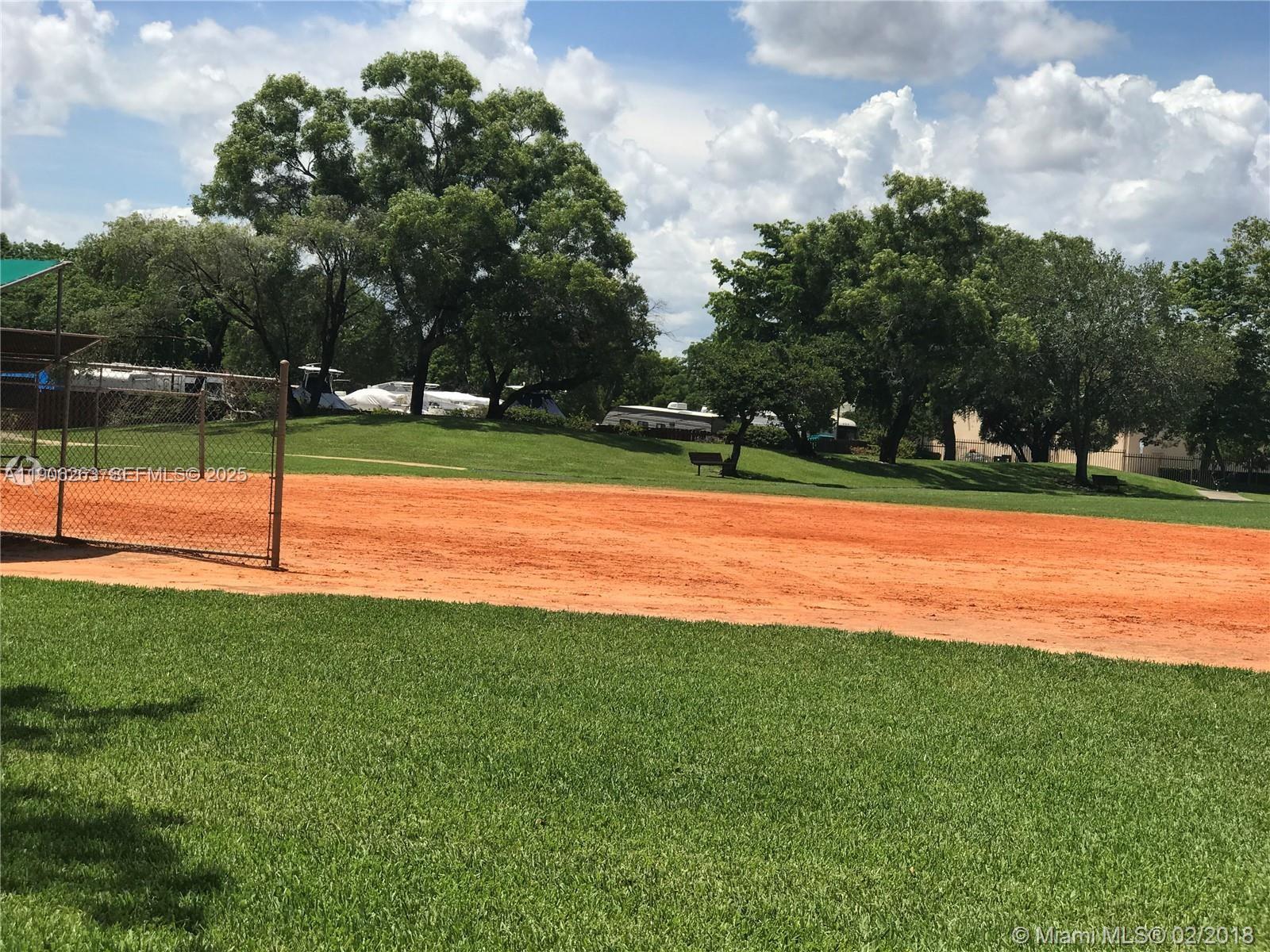 15065 Southwest 49th Lane, Unit E109 Miami, FL 33185 - Photo 20 of 21 a view of a tennis court